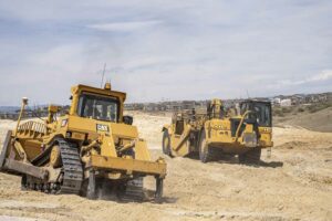 Dozer and Scapers moving dirt on the Canyons South development in Castle Rock, CO
