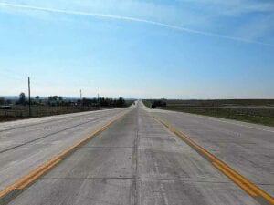 Reconstruction of 20 miles of 5-lane roadway with 937,000 sy of paved concrete